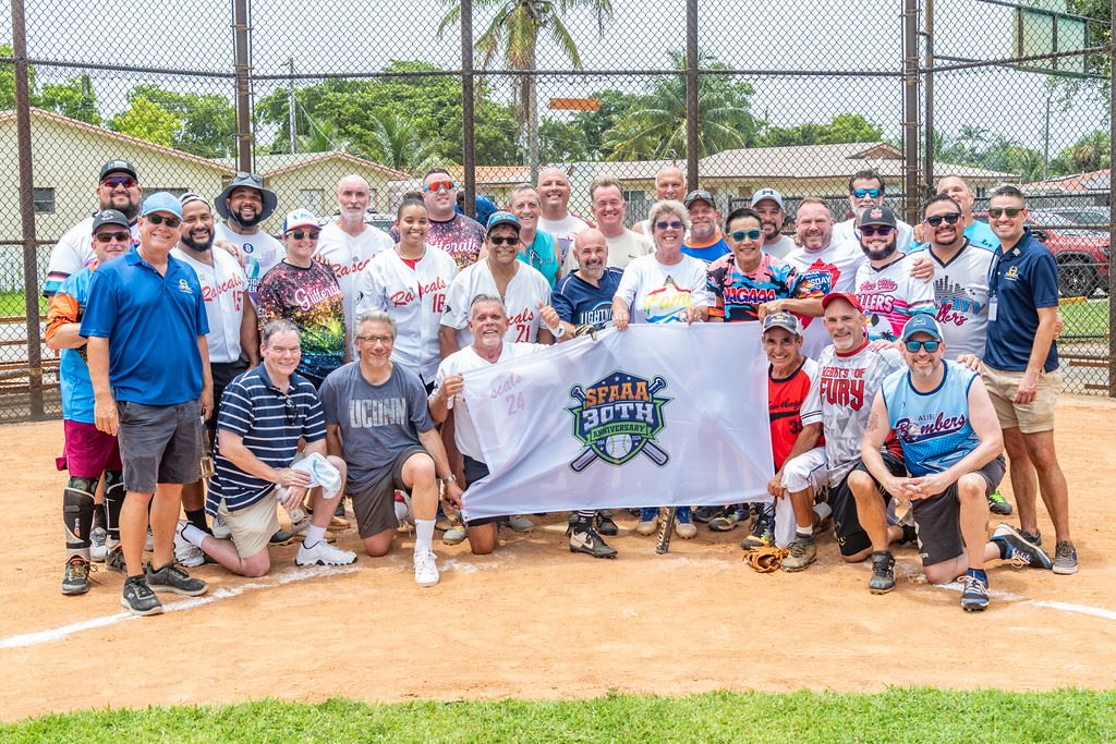 Photo of softball team at 30th anniversary game  